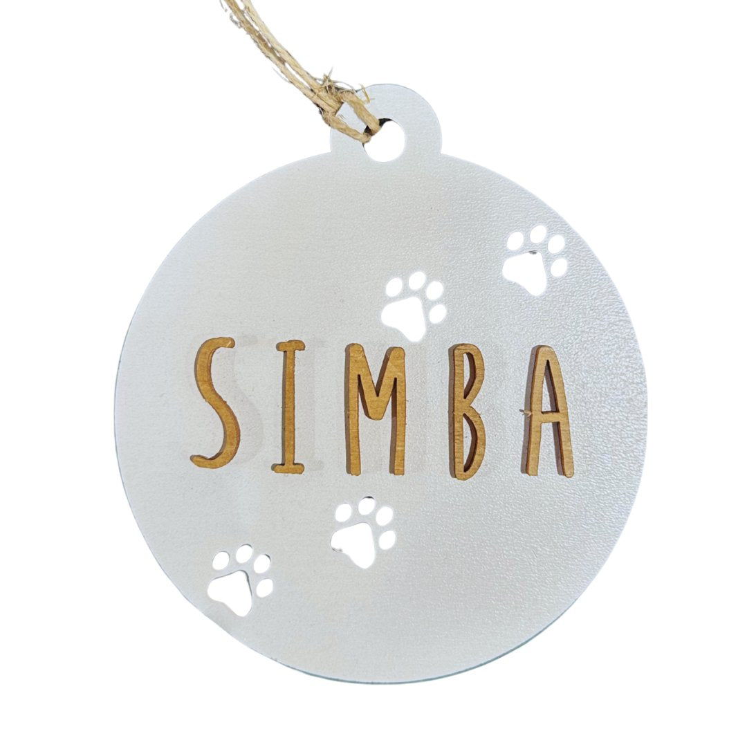 Bola de Navidad blanca con huellas de perro y nombre SIMBA